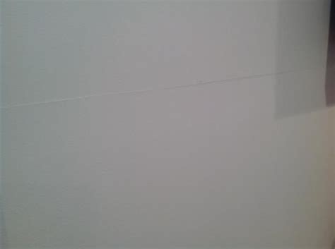 There was a heavier photo frame in front of the problem seam in the attached picture. Drywall seams cracking - how to repair for good ...