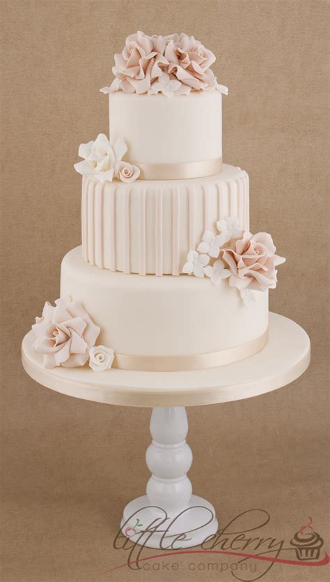 Center a cake board the same size as the tier above it on base tier and press it gently into icing to imprint an outline. Roses And Stripes 3 Tier Wedding Cake - CakeCentral.com