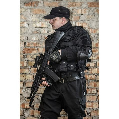 Special Forces Operator In Black Uniform And Bulletproof Vest Poster