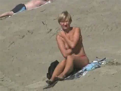 Lovely Blonde Milf Half Naked Sun Bathing On The Beach