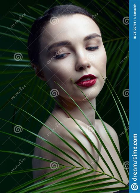Romantic Female With Palm Leaves On Green Background Stock Image
