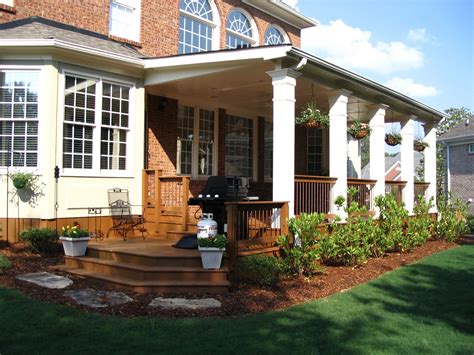A Nice Expansive Open Back Porch With Square Columns Set Off This Handsome Brick Home Back