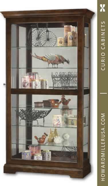 These display cabinets with locks can keep valuable curios and merchandise secure! Modern Howard Miller Cherry Curio Cabinet 680537 | Curio ...