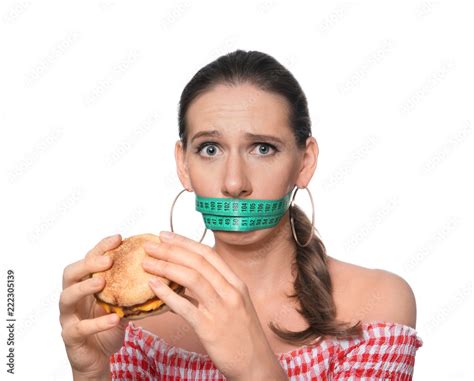 Emotional Woman With Measuring Tape Around Her Mouth And Tasty Burger