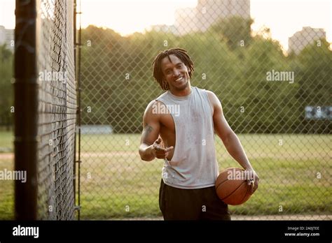 African American Man Playing Basketball Outdoors Stock Photo Alamy