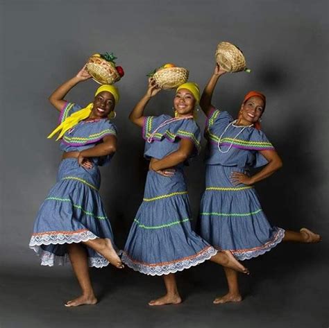 Three Women In Blue Dresses Are Holding Baskets And Posing For The Camera With Their Hands On