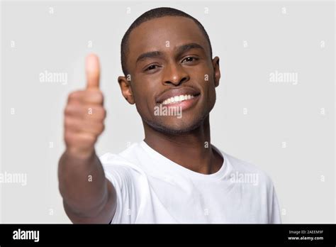 Close Up Smiling Happy African American Man Showing Thumbs Up Stock