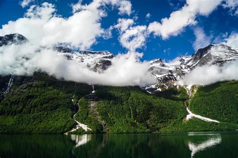 Time Lapse Of Snow Capped Mountains Near A Body Of Water · Free Stock Video