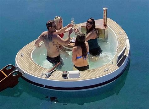 Hot Tub Boat Spacruzzi Drifts On The Sea With Gas Powered Fireplace Stove