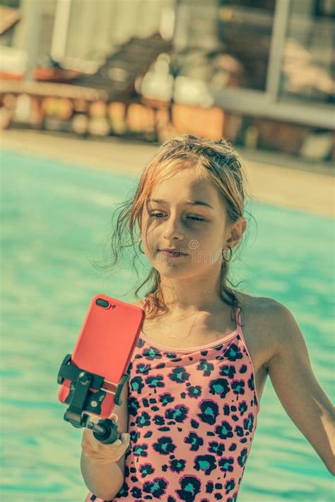 Girl In A Swimsuit Makes A Selfie Near The Pool Smartphone Teenager Stock Image Image Of