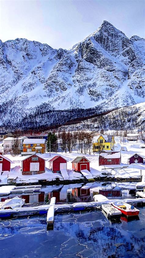 Download Wallpaper 720x1280 Norway Mountains Buildings Bay Winter