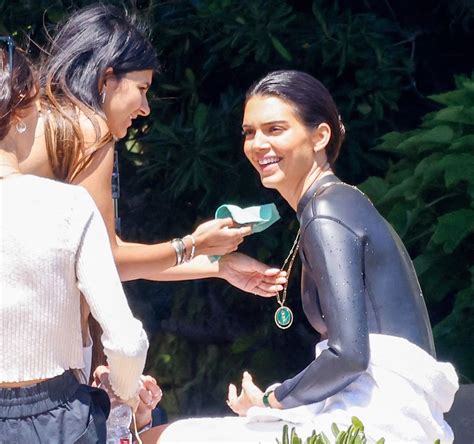 kendall jenner models wet suit and latex crop top in st tropez