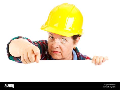Female Construction Worker Leaning Over Blank Space And Pointing With