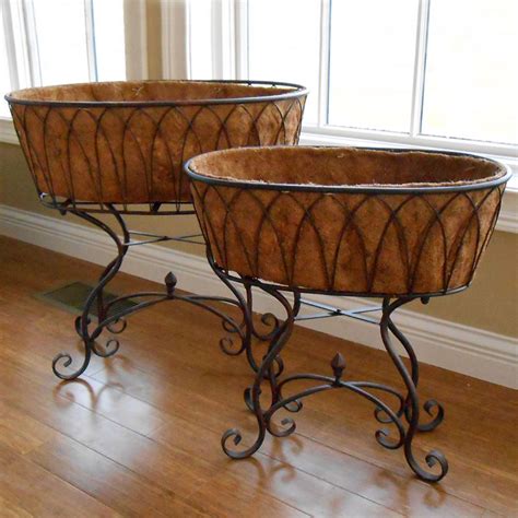 The strength is approximately equal to that of structural steel. Wrought Iron Planters with Plant Stands - Hooks & Lattice