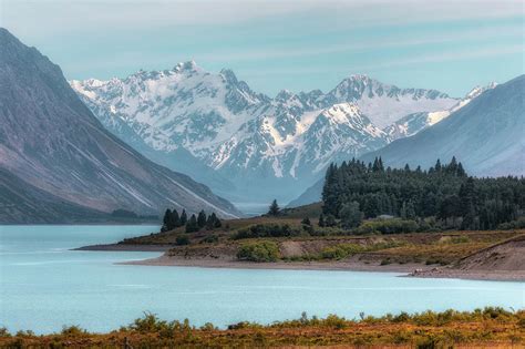 It's located on the south island of new zealand, and is surrounded by amazing mountainous landscapes. Lake Tekapo - New Zealand Photograph by Joana Kruse