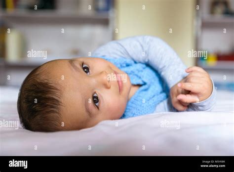 Eurasian Baby Lying On Bed Stock Photo Alamy