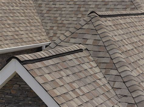 For example, a dark gray or black roof will look good with a gray or blue house, while a brown, cream or tan colored house will match better with brown shingles or a mix of cream and brown. Residential Roofing Home Page | Wood roof shingles, Wood roof, Wood shingles