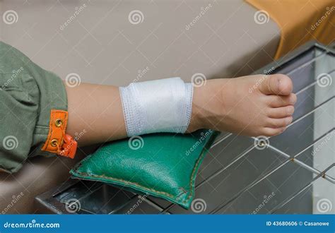 Child Boy With Bandage On Leg And Lying Down Hospital Bed Stock Photo