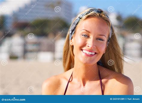 Summer Sun And Happy Smiles A Sun Kissed Woman Relaxing On The Beach In A Bikini Stock Image