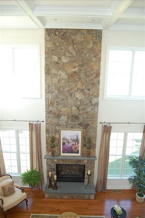 Like a wood mantel, this stone/resin mantel should not come into direct contact with flames. floor to ceiling stone fireplace - Google Search ...