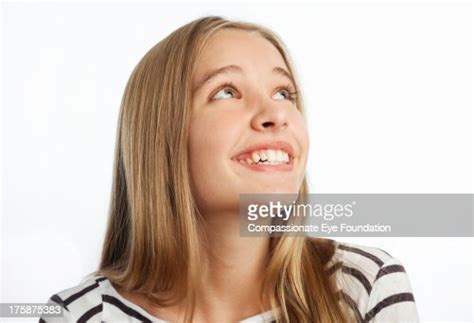 Close Up Of Smiling Girl Looking Up High Res Stock Photo Getty Images