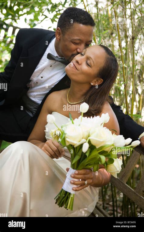 Happy African American Groom Kissing His Bride Outdoors Stock Photo Alamy