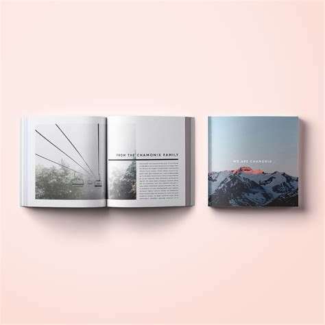 An Open Book On Top Of A Pink Surface With Mountains In The Background