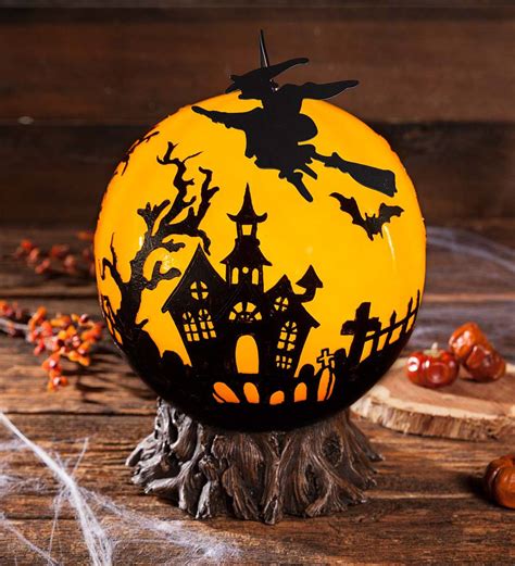Glowing Halloween Ball With Rotating Witch | PlowHearth