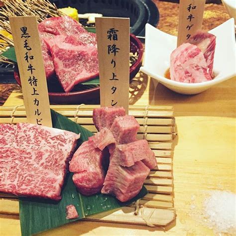 Raw Meat Is Displayed On Bamboo With Chopsticks