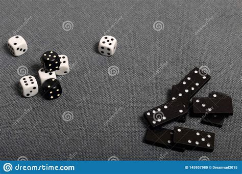 White Dice With Black Markings They Lie On A Surface Covered With A