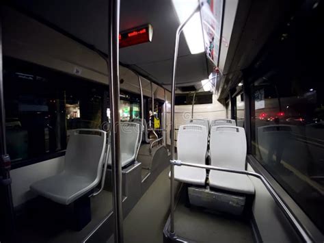Interior Of A Public Transport Bus With Empty Gray Seats And No