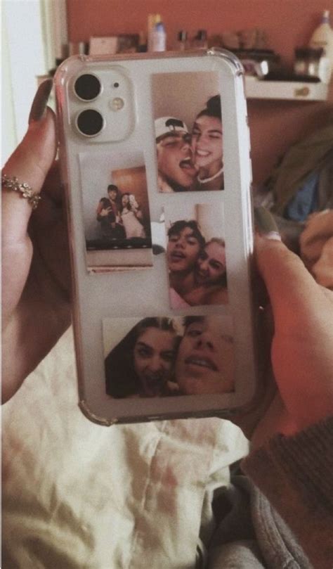 A Person Holding Up A Cell Phone Case With Pictures On The Front And