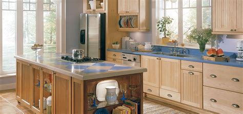 The bookshelves create a visual barrier to the stove and sink areas. Have the Natural Maple Kitchen Cabinets for Your Home - My ...