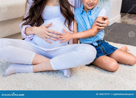 pregnant woman with daughter touching belly stock image image of girl motherhood 100575797