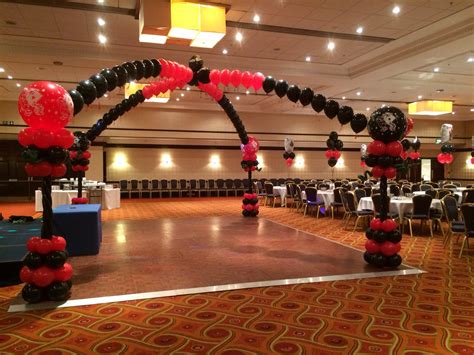 This new stunning elegant wedding dance floor canopy design can create a beautiful dance floor decor instead of a empty spaced dance floor. Vegas themed balloon decor kissing arches dance floor ...