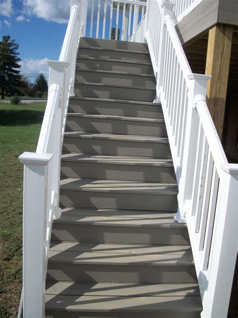 Here is one possible way you can arrange a handrail along a stair rail. Stairs in white vinyl handrail and gravel path decking ...