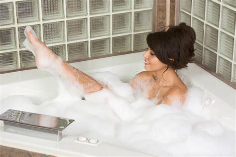 Attractive Young Gorges Woman Taking Bubble Bath Stock