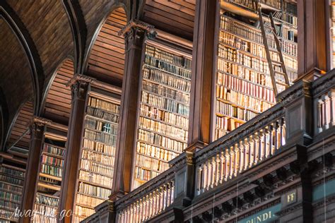The Endless Wooden Shelves Of Books At The Library Of Trinity College
