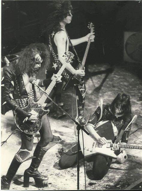 Black And White Photograph Of The Band Kiss Performing On Stage With