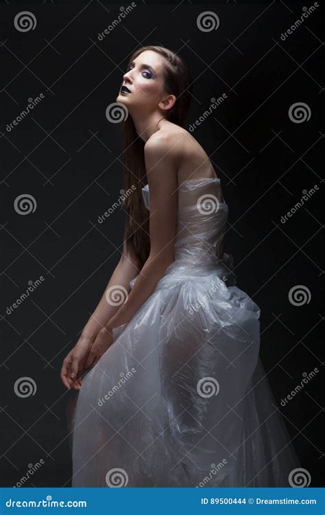 Beautiful Womann Model Shoot In The Studio Semi Nude In Plastic Dress Stock Photo Image Of