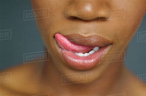 Close Up Of African Woman Licking Lips Stock Photo Dissolve