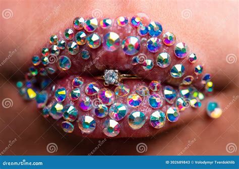 woman lips with diamond ring sensual womens open mouths rich and sexy close up macro with