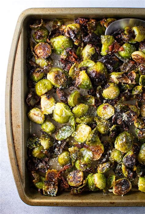 If you're looking for a swap for roasted cabbage recipes, these brussels sprouts have a more kid friendly bite sized crispy texture. Oven Roasted Brussel Sprouts With Bacon and Parmesan Cheese Recipe | Kitchen Swagger