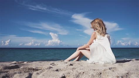 A Girl Sits On The Sand And Sunbathes Stock Footage Videohive