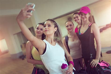 Happy Girlfriends Group Taking Selfie In Gym After Exercise Foto De