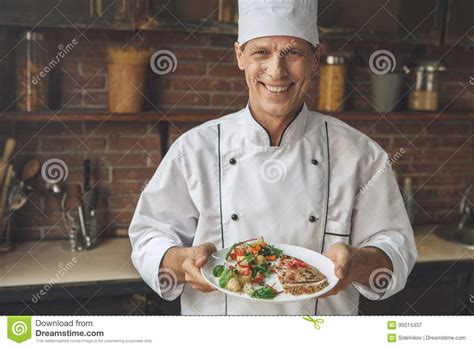 Mature Man Professional Chef Cooking Meal Indoors Stock Image Image