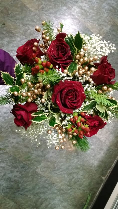 Maybe you would like to learn more about one of these? #christmaswedding #wedding #bridalbouquet #blackmagicroses ...