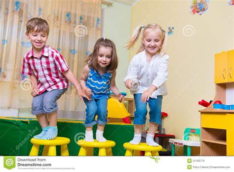 Group Of Happy Preschool Kids Jumping Stock Images Image 31193774