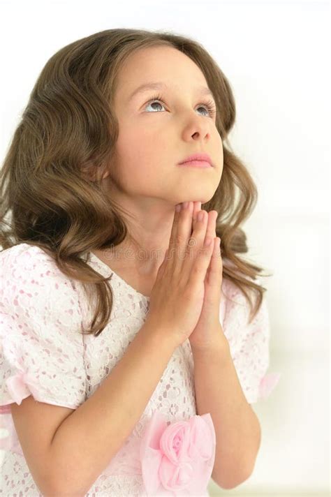 Portrait Cute Little Girl Praying Against White Stock Photos Free