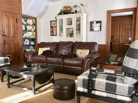 The key to farmhouse living room is using neutral colors and organic materials. Family Room, buffalo checks, brown leather couch, china ...